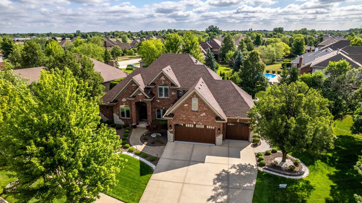 A finished suburban home exterior after a completed roofing job